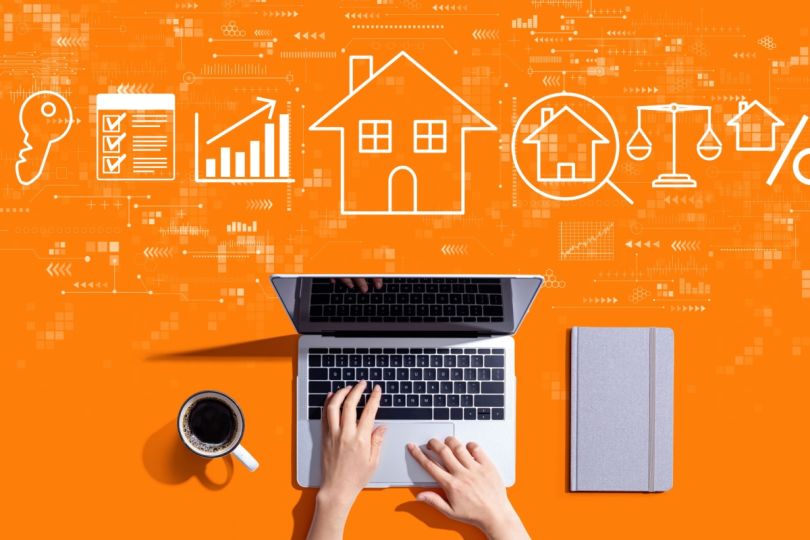 A laptop with an array of business and home-related icons.
